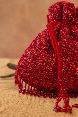 Red shimmer viel potli, close-up detail, by Nayaab by Sonia at Mrs. G
