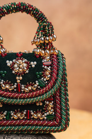 Green empress charm flap bag, close-up detail, by Nayaab by Sonia at Mrs. G