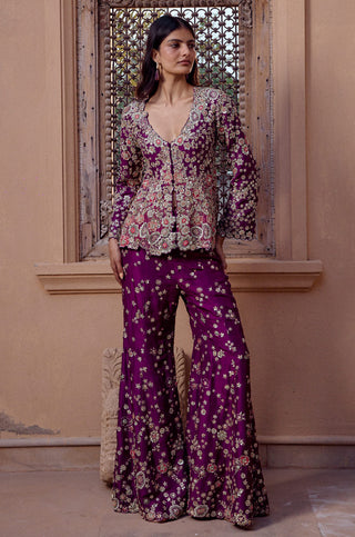 Front view of aubergine jacket with plunging V-neck and scattered floral flared pants by Osaa by Adarsh at Mrs. G
