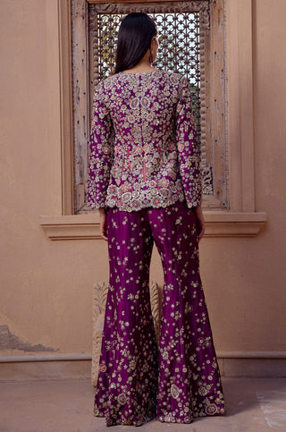 Back view of aubergine jacket embroidered across the back over flared pants by Osaa by Adarsh at Mrs. G