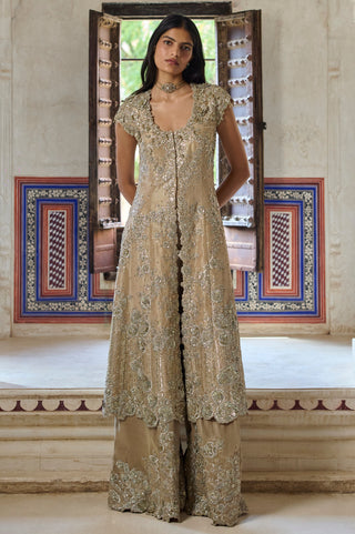Front view of beige champagne long jacket with scoop neck, cap sleeves and embroidered flared pants by Osaa by Adarsh at Mrs. G