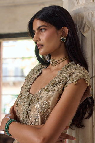 Side close-up of dimensional flowers and beaded cap sleeve on the beige champagne jacket by Osaa by Adarsh at Mrs. G