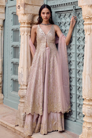 Front view of camellia pink sleeveless V-neck jacket over flared garara with tulle dupatta by Osaa by Adarsh at Mrs. G