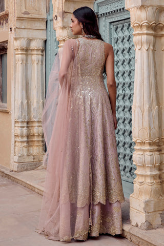 Back view of camellia pink jacket with sequin work and tulle dupatta over garara by Osaa by Adarsh at Mrs. G