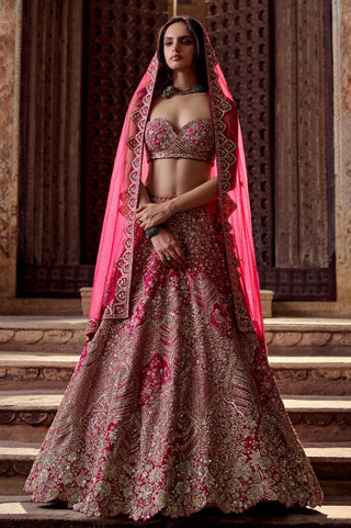 Dark fuchsia bridal lehenga worn with the net veil over the head, front full-length view by Osaa by Adarsh at Mrs. G