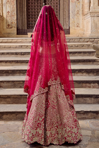 Back view of dark fuchsia lehenga under the net veil with embroidered scalloped hem by Osaa by Adarsh at Mrs. G