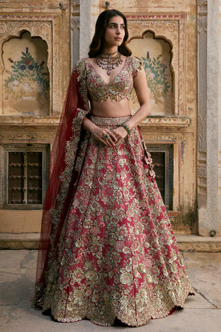 Front view of deep berry bridal lehenga with V-neck blouse, floral zardozi skirt and red tulle dupatta by Osaa by Adarsh at Mrs. G