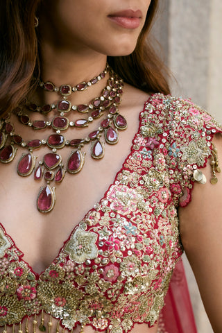 Close-up of deep berry V-neck blouse with raised flowers, coin tassel drops and sequins by Osaa by Adarsh at Mrs. G