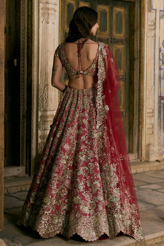 Back view of deep berry blouse with open back and beaded tie-up strings above the flared skirt by Osaa by Adarsh at Mrs. G