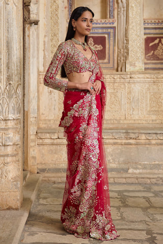 Three-quarter side view of the deep berry tulle saree with embroidered floral clusters at the hem by Osaa by Adarsh at Mrs. G