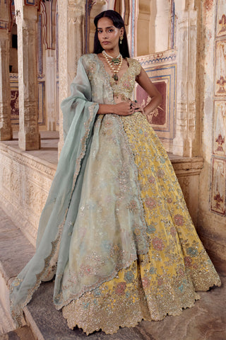 Front view of the maize yellow zardozi lehenga with pale blue-green organza dupatta and V-neck blouse by Osaa by Adarsh at Mrs. G