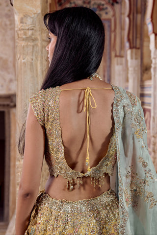 Close-up of the maize yellow blouse back with tie closure, coin tassels and embroidered scalloped edge by Osaa by Adarsh at Mrs. G