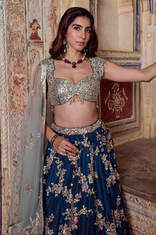 Waist-up close-up of midnight blue sweetheart blouse with beaded tassel drops and zardozi waistband by Osaa by Adarsh at Mrs. G