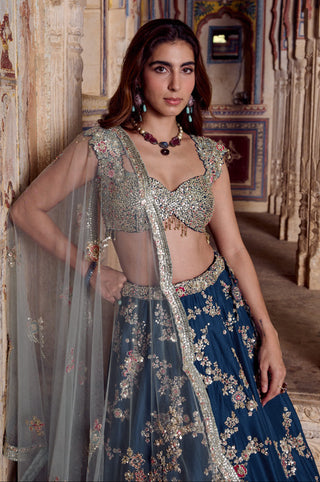 Waist-up view of midnight blue blouse with scalloped cap sleeves and tulle dupatta border by Osaa by Adarsh at Mrs. G