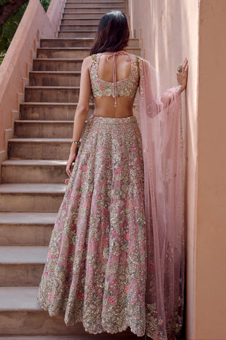 Back view of the oyster pink floral lehenga with scooped tie-back blouse and sequined tulle dupatta by Osaa by Adarsh at Mrs. G