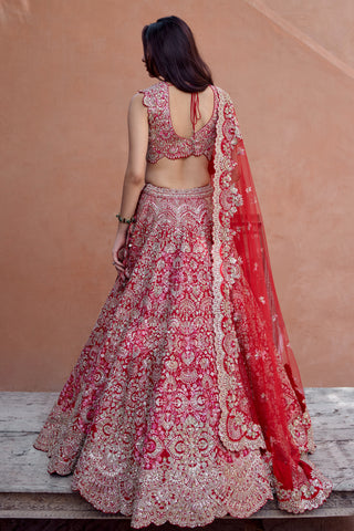 Back view of rosewood red bridal lehenga with tie-up open-back blouse and scalloped hem border by Osaa by Adarsh at Mrs. G