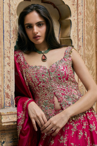 Waist-up view of ruby pink peplum top with floral sequin work and dupatta edge by Osaa by Adarsh at Mrs. G