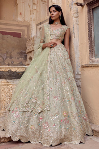 Full-length front view of sage lehenga set with scalloped zardozi hem and net dupatta by Osaa by Adarsh at Mrs. G