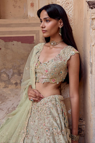 Waist-up close-up of V-neck cap-sleeve blouse with pink and aqua flowers and zardozi by Osaa by Adarsh at Mrs. G
