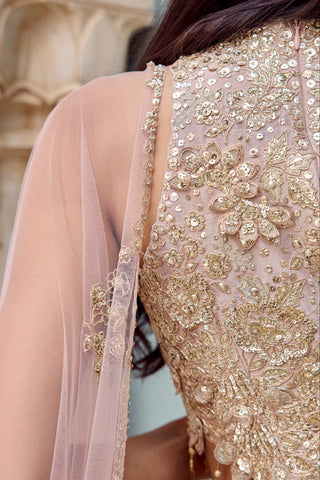 Back close-up of tan blouse with floral zardozi and sheer tulle dupatta edge by Osaa by Adarsh at Mrs. G
