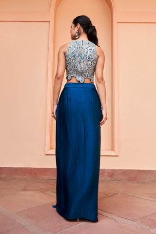 Back view of jade blue sleeveless embroidered top with scalloped hem and plain skirt by Osaa by Adarsh at Mrs. G