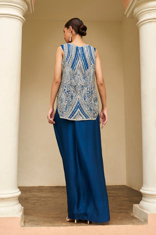 Back view of jade blue sleeveless embroidered jacket and draped skirt by Osaa by Adarsh at Mrs. G