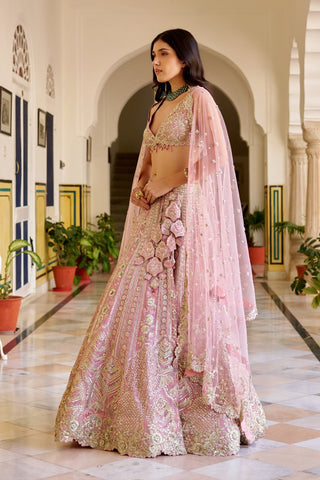 Side view of rosaline pink lehenga with a cluster of tonal fabric petals at the hip by Osaa by Adarsh at Mrs. G