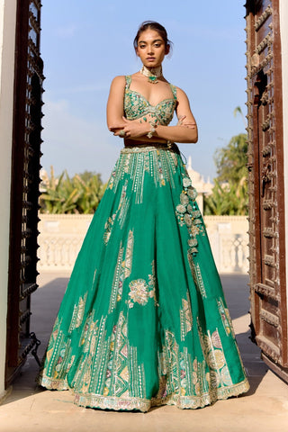 Front view of jewel green lehenga with vertical zardozi lines and scalloped hem by Osaa by Adarsh at Mrs. G