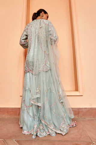 Back view of pastel blue kurta with net dupatta and tiered embroidered sharara by Osaa by Adarsh at Mrs. G