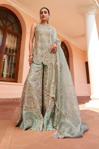 Front view of cadet blue sharara set with scalloped organza dupatta draped over the shoulder by Osaa by Adarsh at Mrs. G
