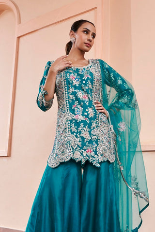 Closer front view of the pine green rasm embroidered sharara by Osaa by Adarsh at Mrs. G
