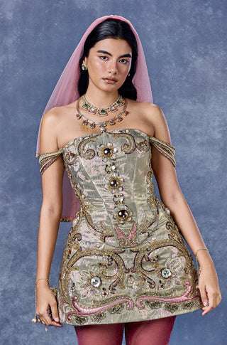 Front view of the sage green babydoll dress worn with a pink veil for styling at Mrs. G