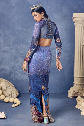 Back view of the blue skirt set with a sheer beaded back and a slit at the hem at Mrs. G