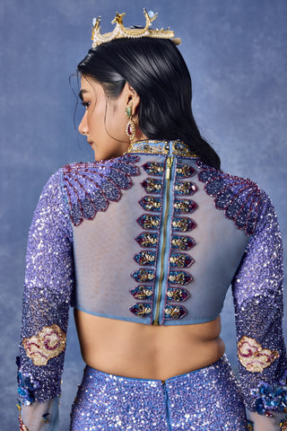 Zoomed-in back of the blue blouse with beaded detail on a sheer panel at Mrs. G
