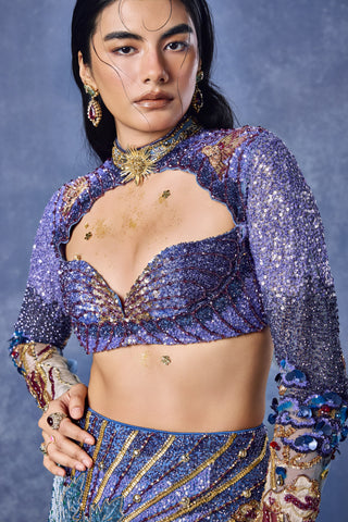 Close-up of the sweetheart neckline and sequins on the blue blouse at Mrs. G