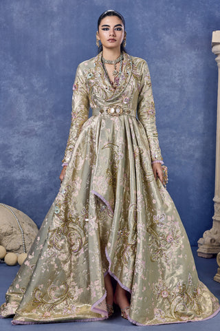 Front view of the sage green sacred bouquet jacket gown with a jeweled belt at Mrs. G