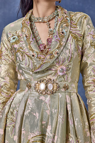 Zoomed-in shawl collar and jeweled belt of the sage green gown at Mrs. G