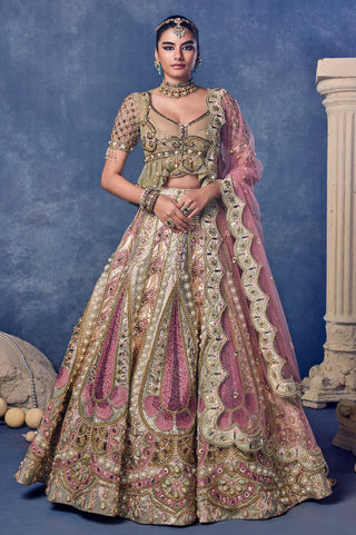 Front view of the green madonna in bloom lehenga set with a pink dupatta at Mrs. G