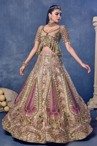 Front view of the gold jacquard lehenga with pink paisley panels in full flare at Mrs. G