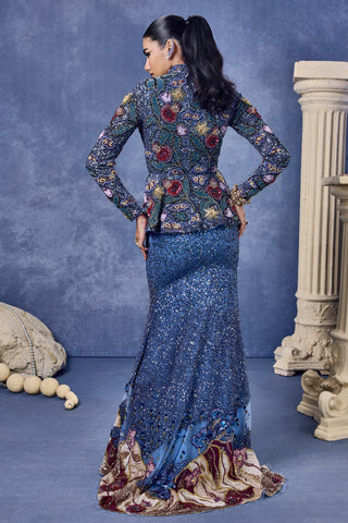 Back view of the embroidered blue jacket and fish cut skirt at Mrs. G