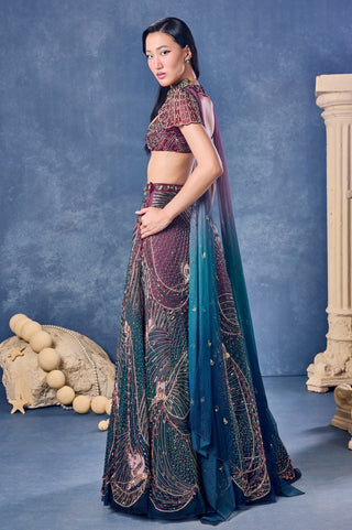 Side view of the ombre lehenga with a long dupatta drape from the shoulder at Mrs. G