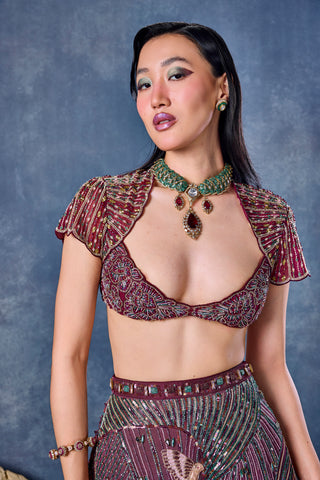 Close-up of the beaded maroon blouse with cap sleeves and a plunging neckline at Mrs. G