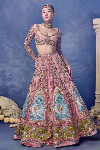 Front view of the dusty rose velvet siren lehenga set with a net jacket at Mrs. G