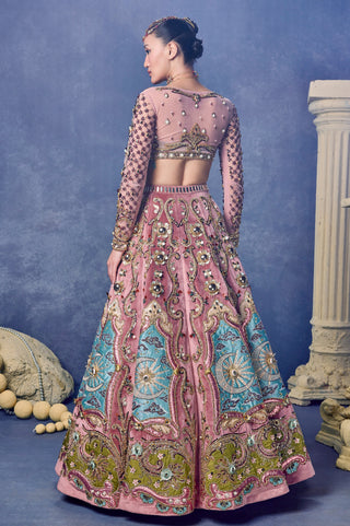Back view of the sheer net jacket with beaded sleeves and the velvet lehenga at Mrs. G