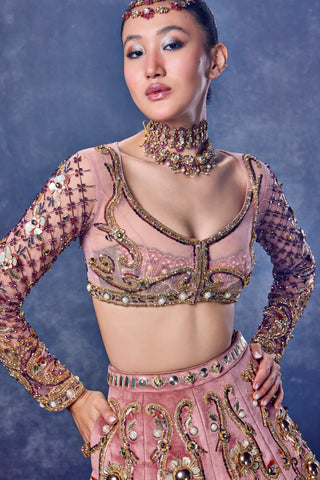 Close-up of the scooped neckline and gold trim on the net jacket and bralette at Mrs. G