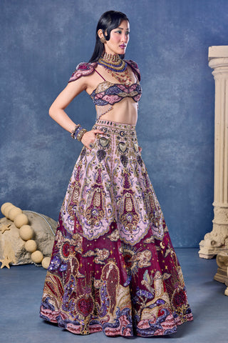 Front view of the wine tulle lehenga with a winged shoulder blouse at Mrs. G