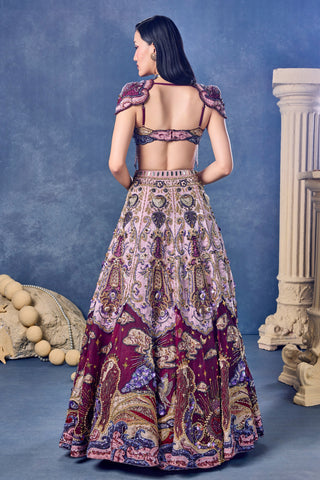 Back view of the wine blouse with winged shoulder pieces and the embroidered lehenga at Mrs. G