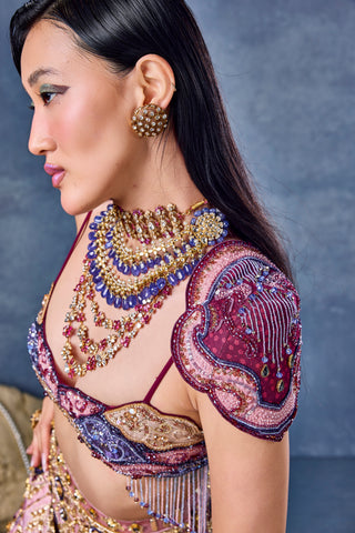 Side close-up of the winged shoulder piece and beaded fringe on the wine blouse at Mrs. G