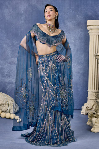 Front view of the teal blue immaculate lehenga set with a sheer dupatta at Mrs. G