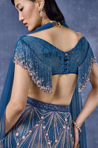 Zoomed-in lace blouse back with covered buttons and fringed sleeves at Mrs. G